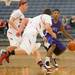 Pioneer's Devon Campbell drives the ball down court as he is being graded by two Pinckney players at Chelsea's holiday basketball tournament on Thursday Dec. 27th.
Courtney Sacco I AnnArbor.com 